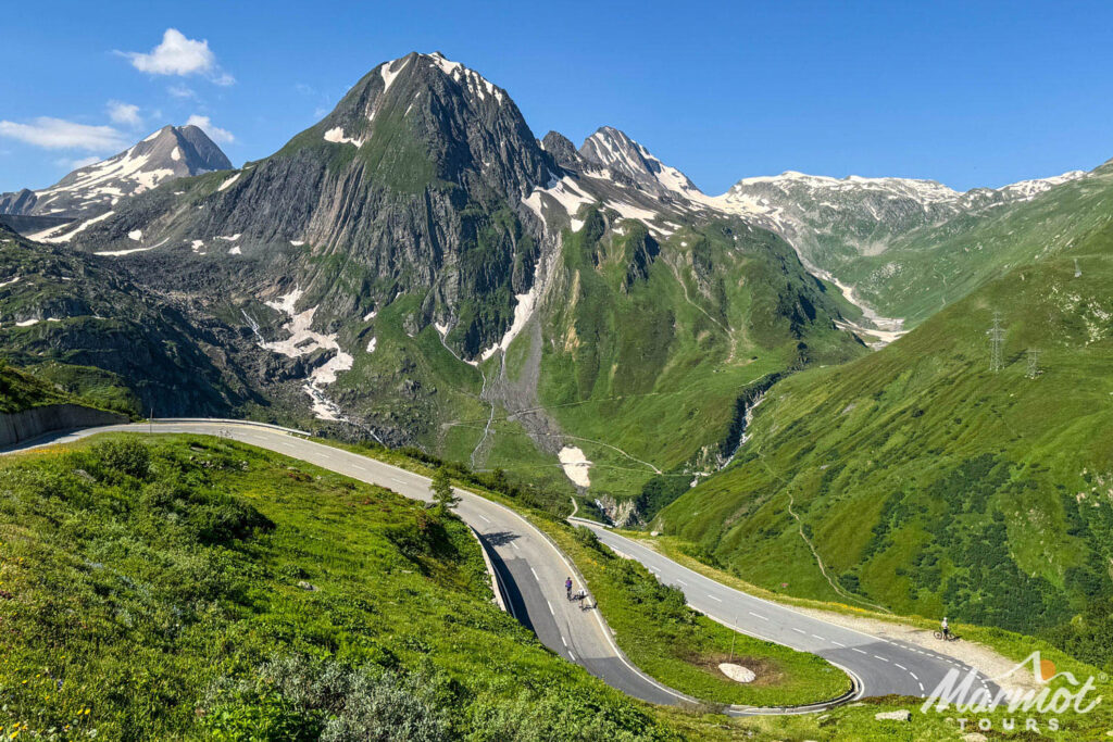 North face of the Eiger Swiss Alps with cyclists climbing Grosse Scheidegg on Marmot Tours road cycling tour