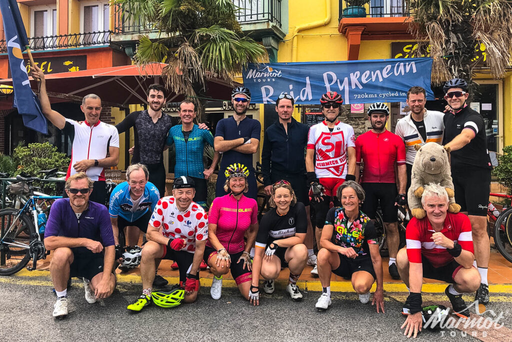 Group of cyclists celebrating at the finish of Raid Pyrenees on Marmot Tours guided road cycling holiday