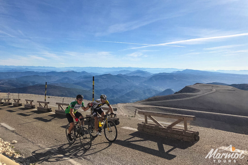 Pair of cyclists summiting Mont Ventoux with Marmot Tours guided road cycling tours