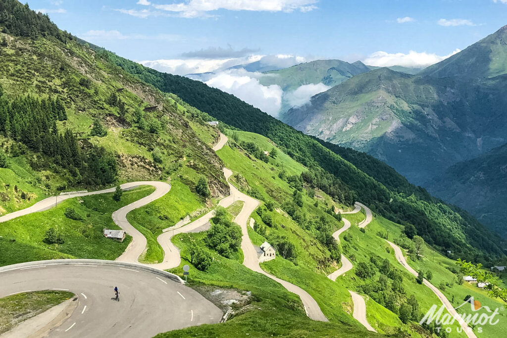 Cyclists climbing Luz Ardiden switchbacks on French Pyrenees cycling holiday with Marmot Tours