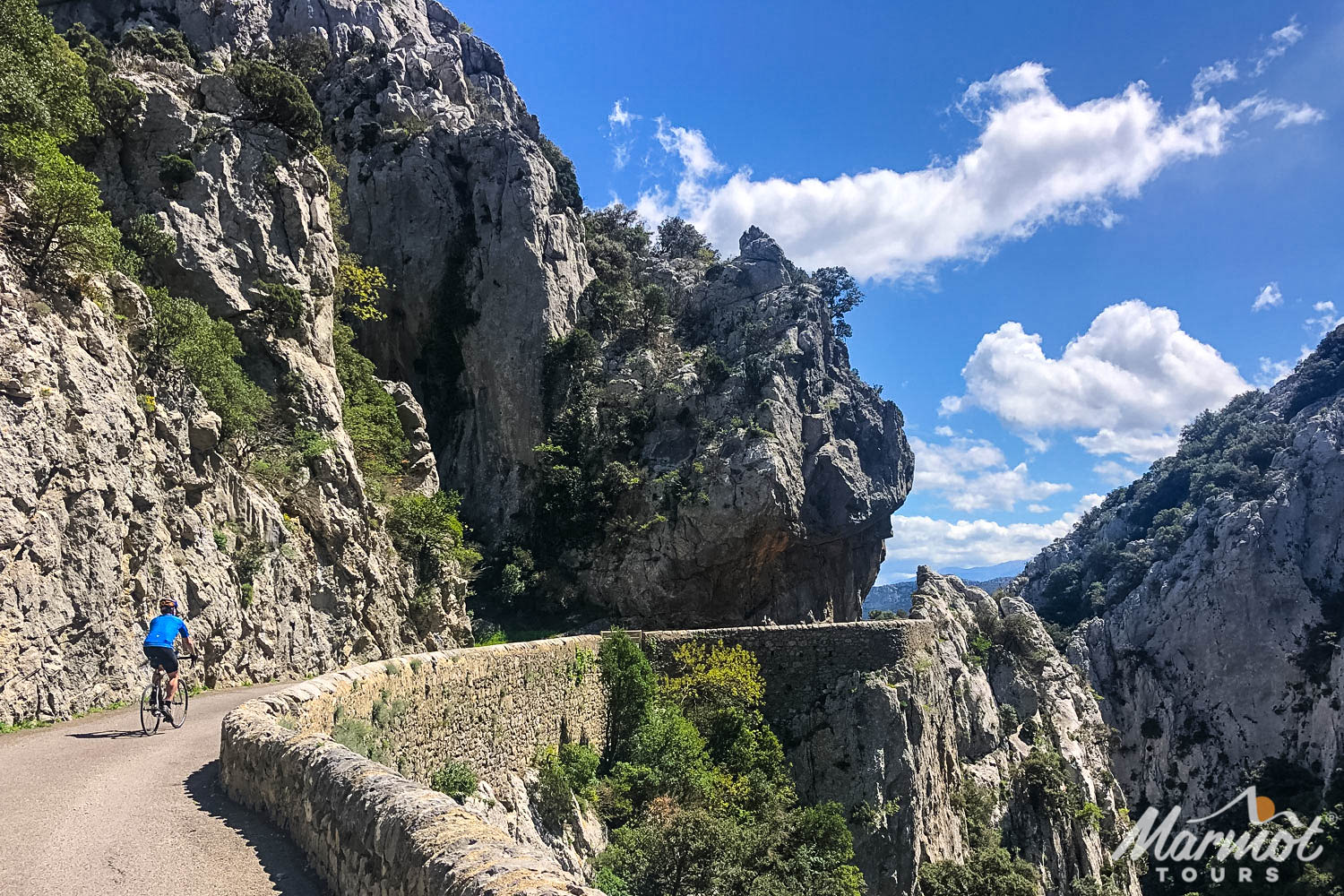 Cyclist riding on balcony road in Pyrenean Foothills on guided road cycling tour with Marmot Tours