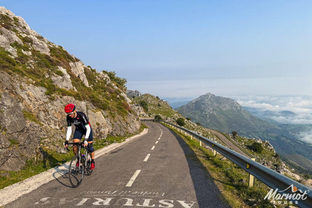 Cyclist nearing the summit of Alto de l'Angliru in Asturias on Marmot Tours guided road cycling holiday