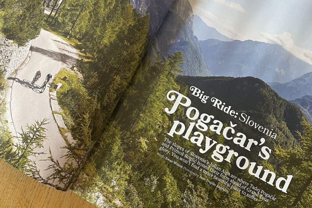 Double page spread of Cyclist issue 168 showing pair of cyclists climbing Mangart Saddle in Slovenia with Marmot Tours guide