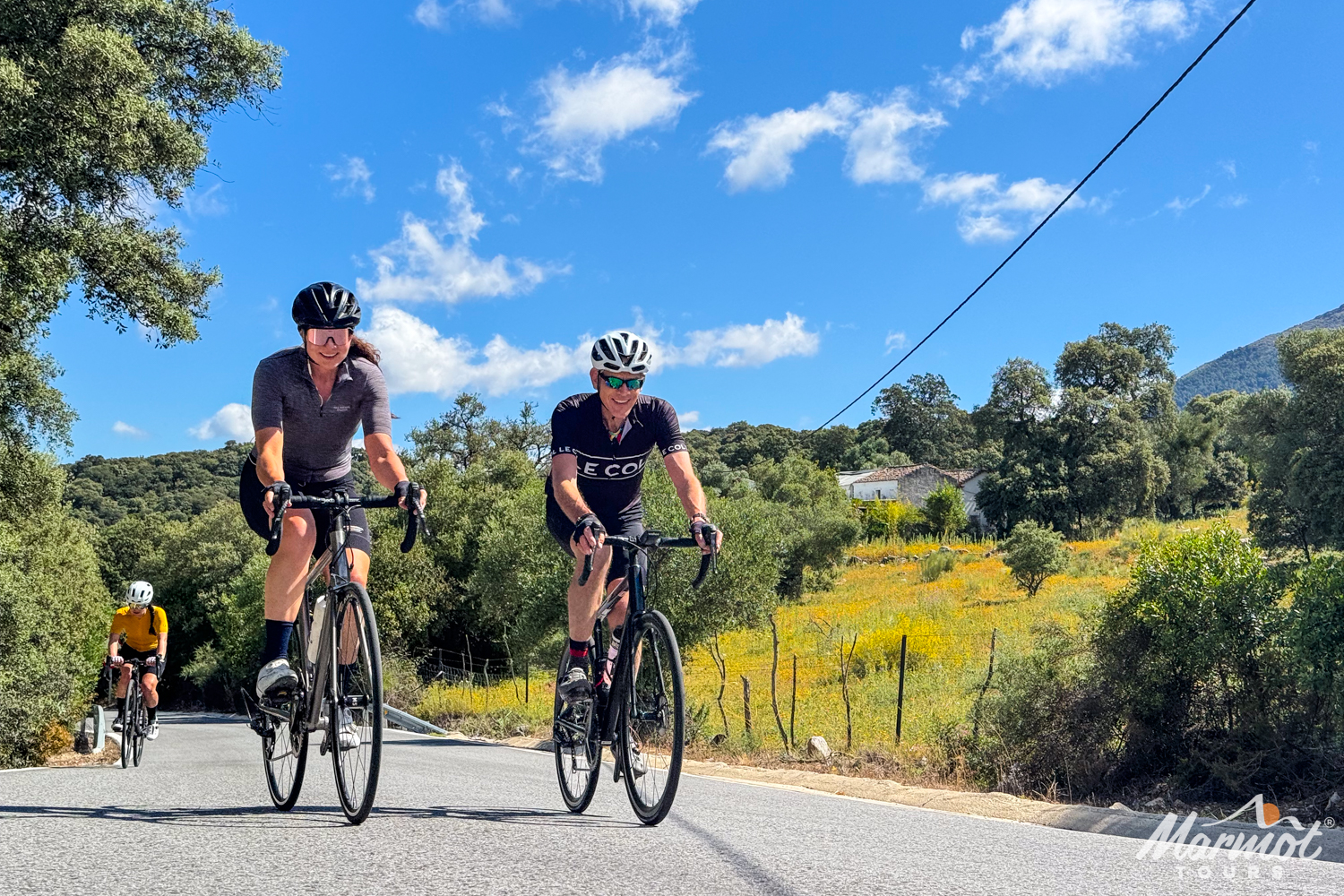 Group of cyclists on sunny ride in Andalusia on Marmot Tours guided cycling holiday in Spain in spring